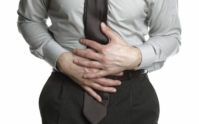 Businessman with stomach ache